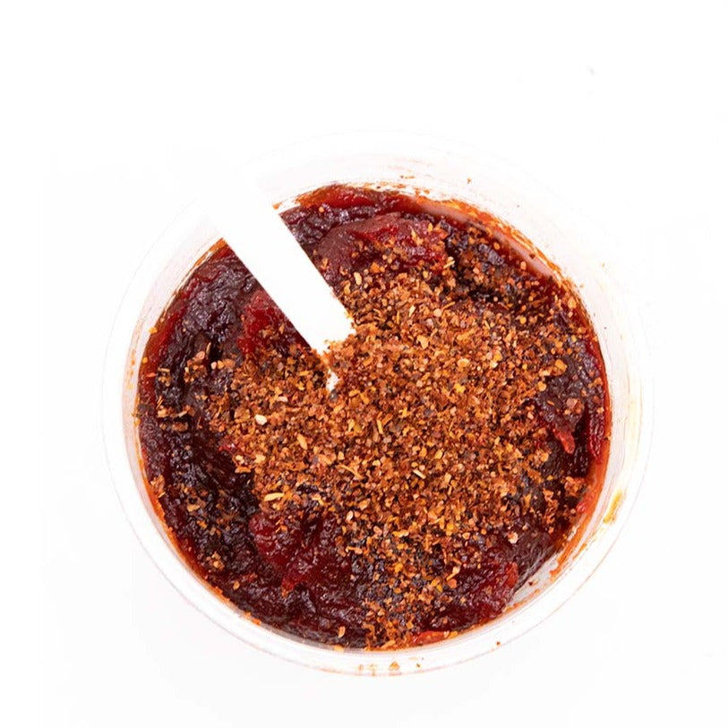 Azteca Chamoyo mango pulp with chili chamoy seasoning close-up Mexican snack