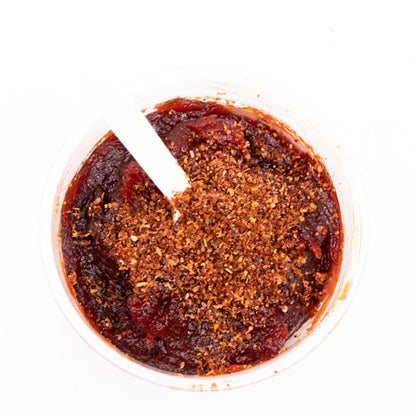 Azteca Mangazo Hot mango pulp with chili seasoning close-up Mexican snack