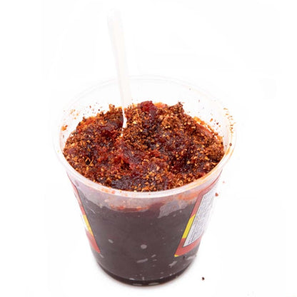 Azteca Mangazo Hot mango pulp with chili seasoning close-up Mexican snack