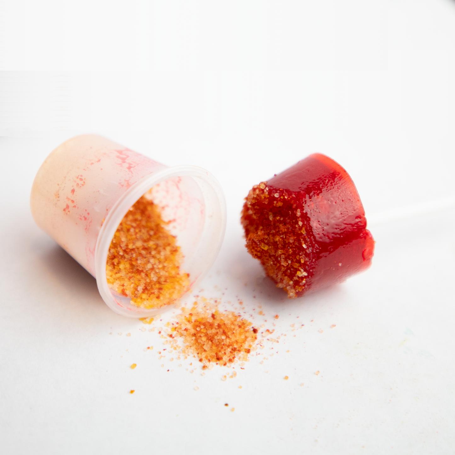 Strawberry hard candy lollipop with chili powder Mexican candy